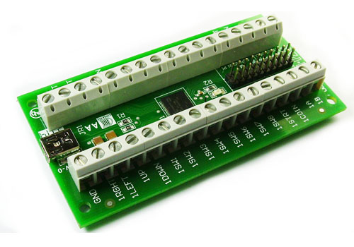 The Ultimarc IPAC-2 Encoder Board -- a green circuit board with screw terminals making it possible to attach up to 34 wires