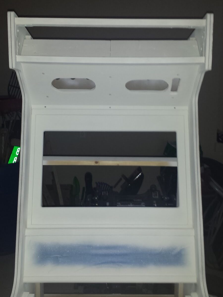 Top half of arcade cabinet, with primer applied