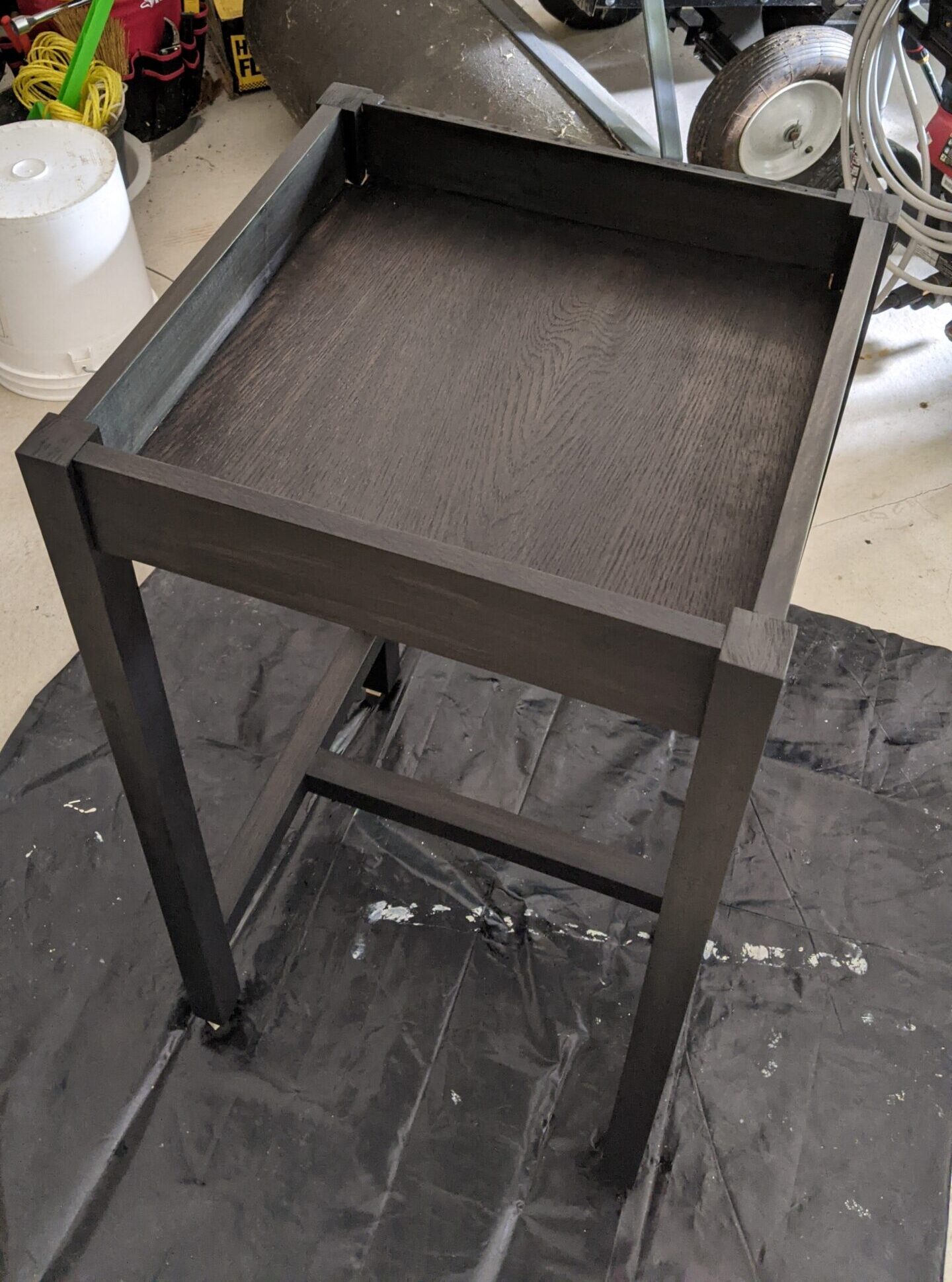 Base/legs stain, on poplar: Minwax True Black; no pre-stain conditioner used (compartment bottom is 1/4" oak plywood, slotted into a groove that I cut into the apron with my table saw)