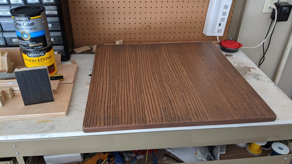 Table top stain, on red oak: 75% Minwax Classic Grey / 25% Minwax Jacobean (note the black-stained scrap on the left with the test cut I made for attaching the bottom of the hidden compartment)